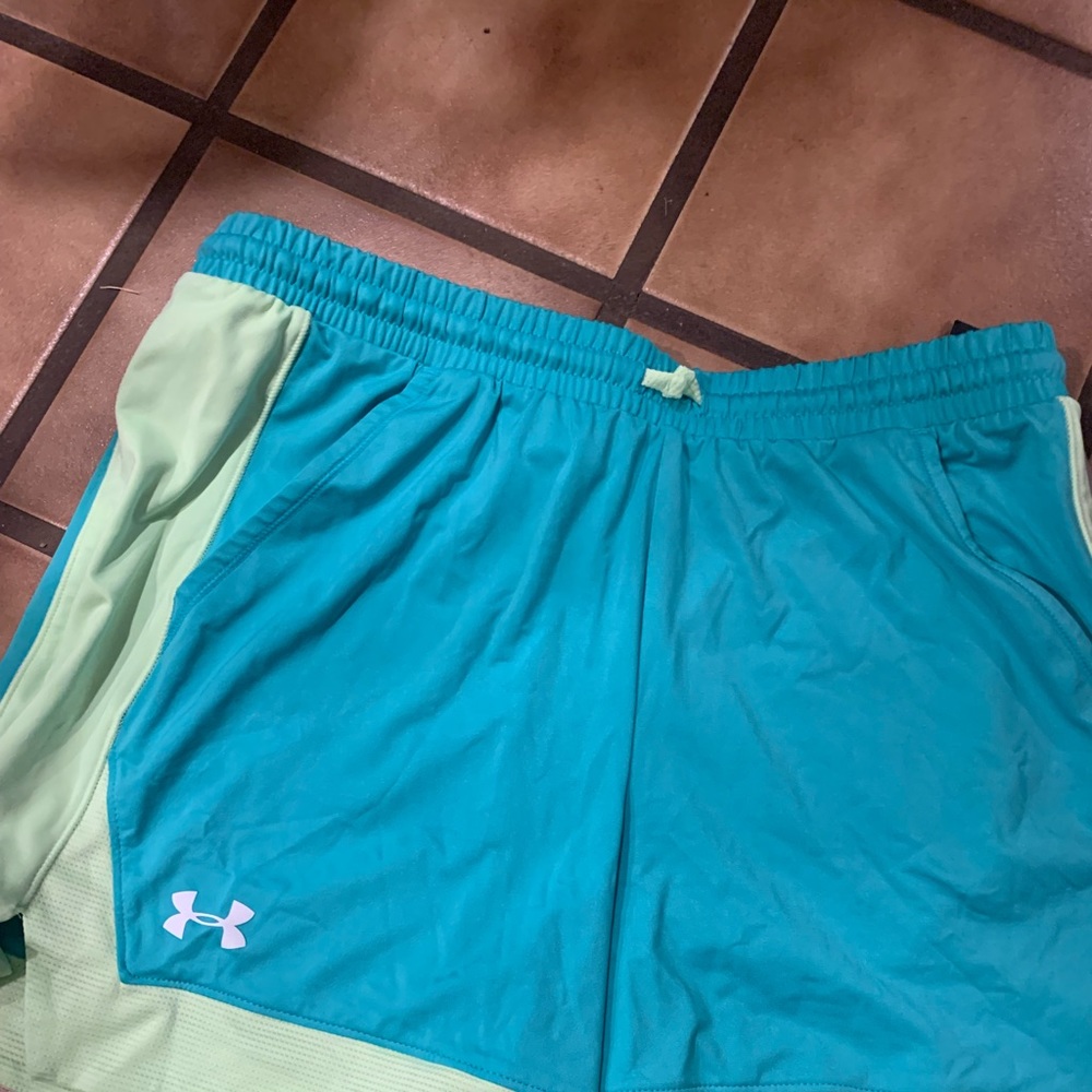 Girls large under armor shorts with tags on them